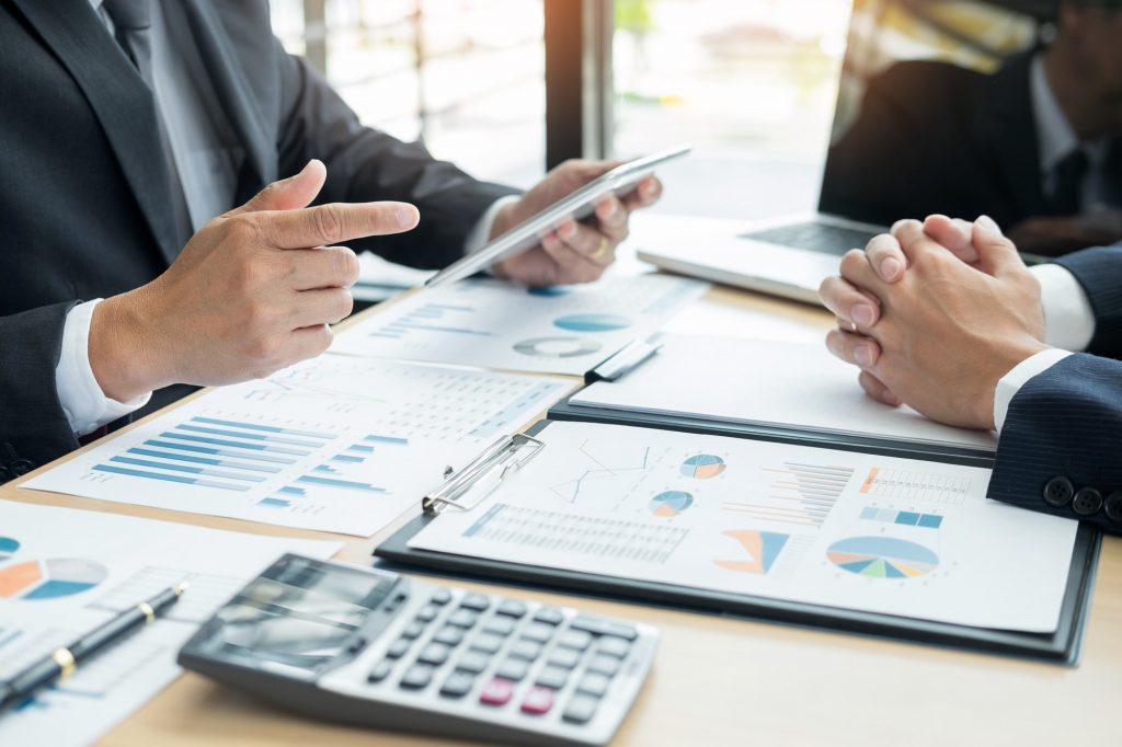 Business People Talking Discussing with coworker planning analyzing financial document data charts