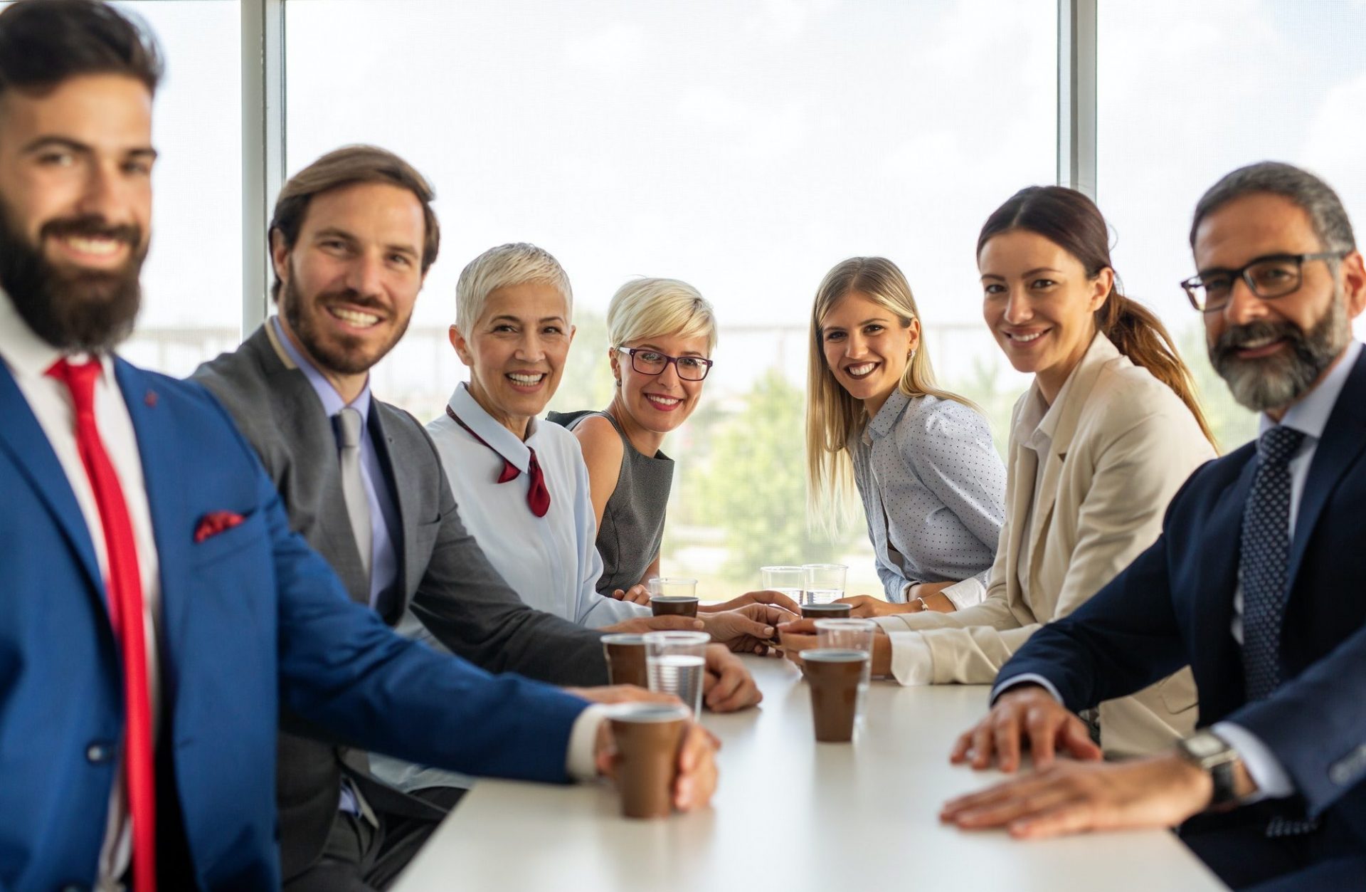Portrait of successful business team posing in office